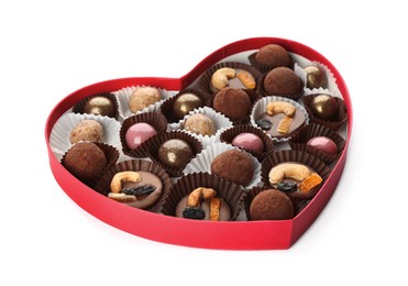 Photo of Delicious chocolate candies in heart shaped box on white background