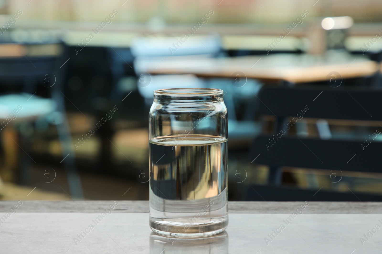 Photo of Glass of fresh water on table indoors