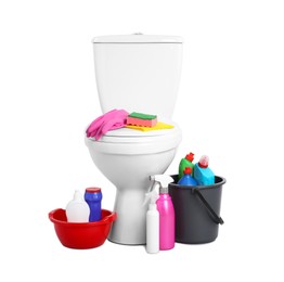 Photo of Toilet bowl and different cleaning supplies on white background