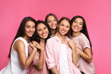 Photo of Happy women on pink background. Girl power concept