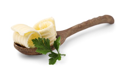 Tasty butter curls and fresh parsley in spoon isolated on white