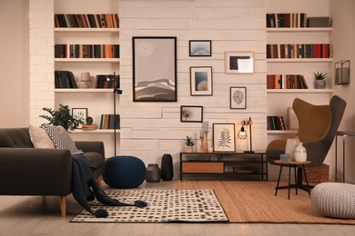 Photo of Cozy home library interior with comfortable furniture and collection of different books on shelves