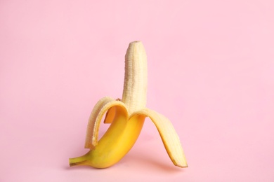 Photo of Fresh banana on pink background. Sex concept