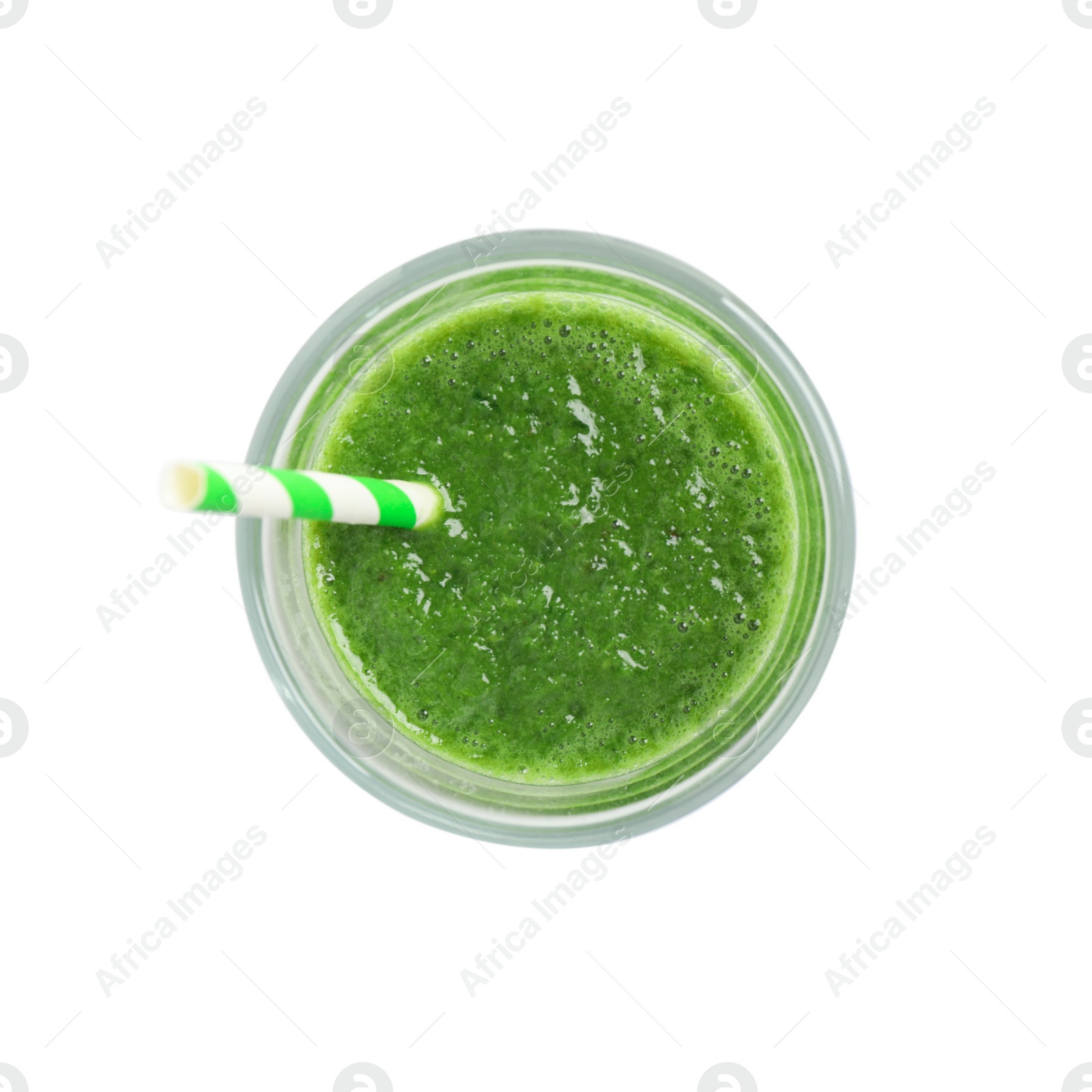 Photo of Green juice and straw in glass isolated on white, top view