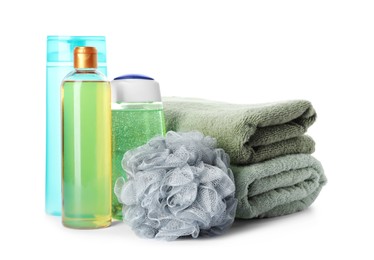 Photo of Personal hygiene products with towels and shower puff on white background