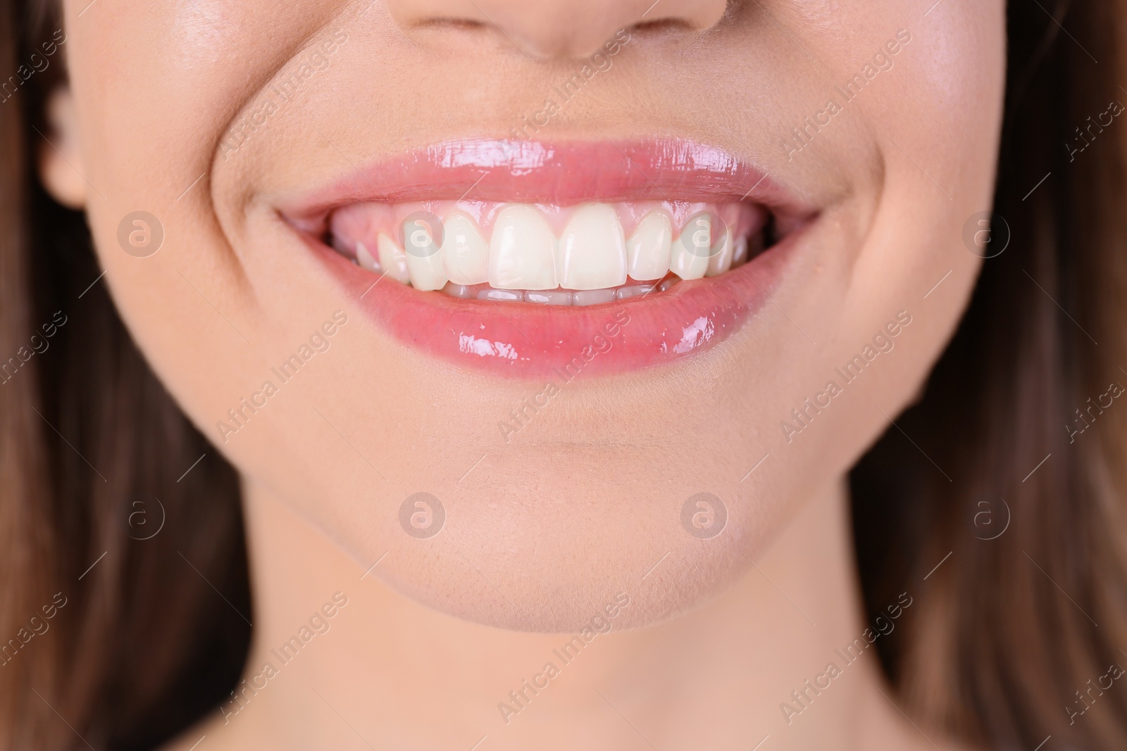 Photo of Young woman with healthy teeth and beautiful smile, closeup