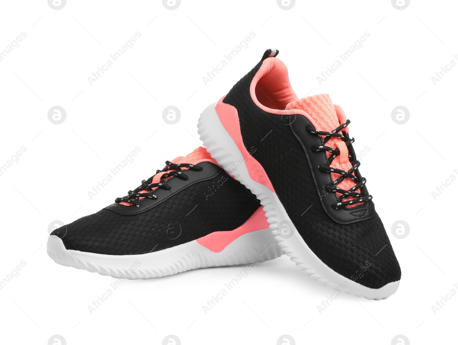 Photo of Pair of comfortable sports shoes on white background