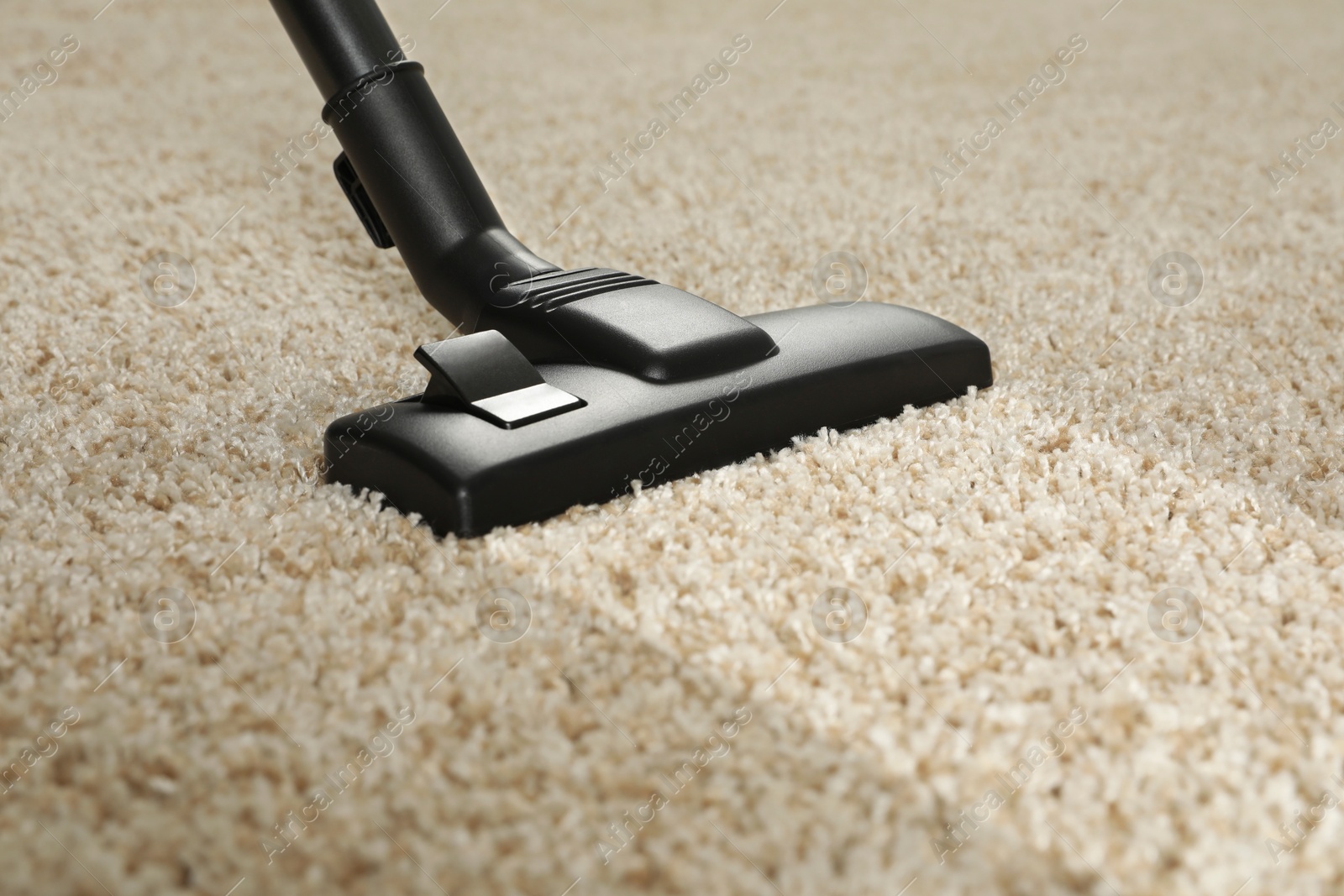 Image of Hoovering carpet with vacuum cleaner, closeup. Clean trace on dirty surface