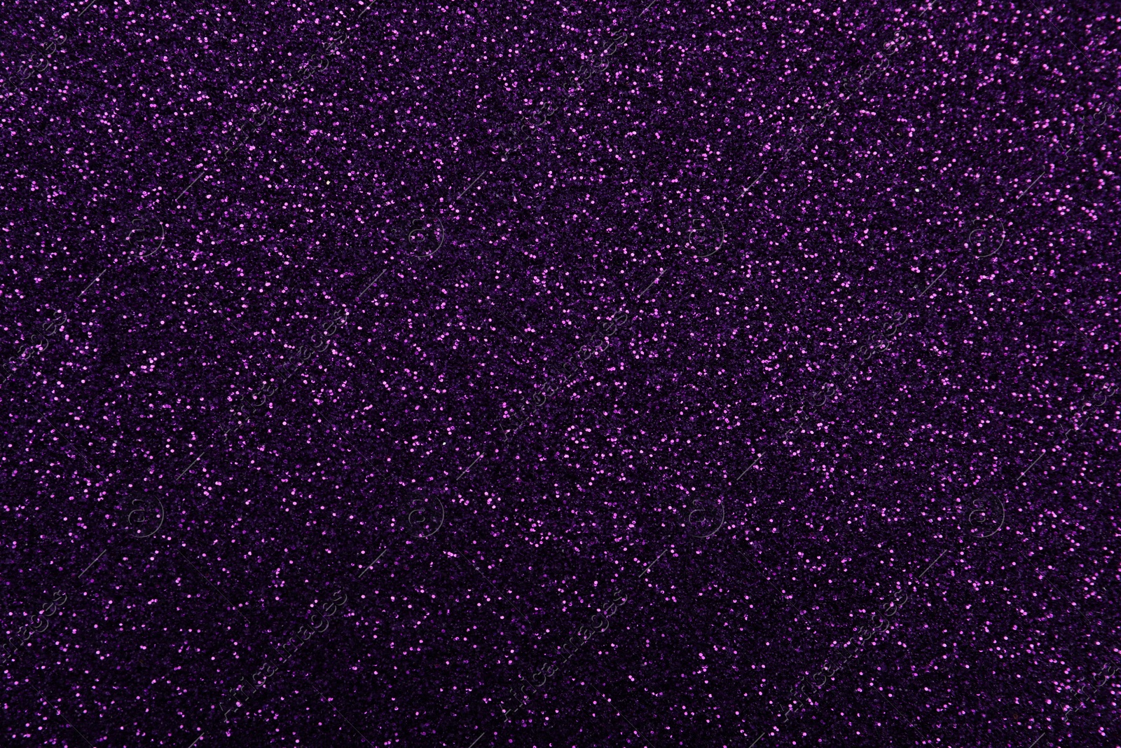 Photo of Shiny dark purple glitter as background, closeup