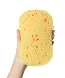 Woman holding new yellow sponge on white background, closeup