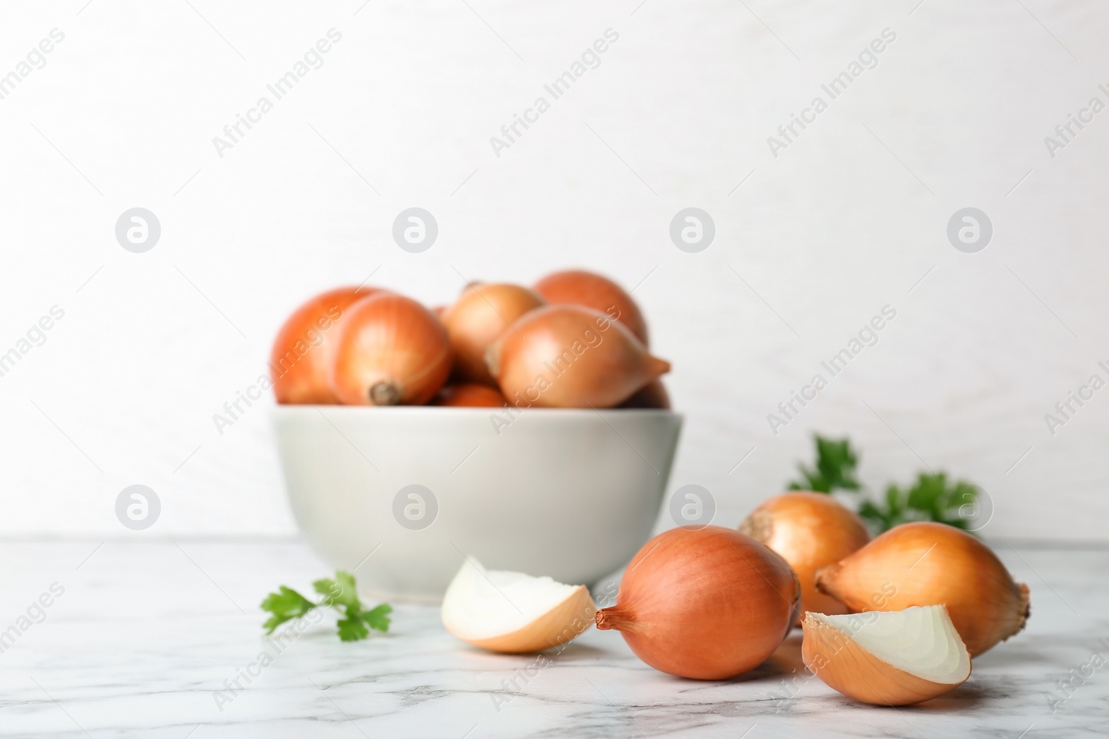 Photo of Composition with fresh ripe onions on table