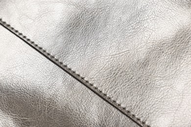 Photo of Natural leather with seams as background, closeup