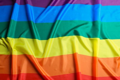 Photo of Bright rainbow gay flag as background. LGBT community