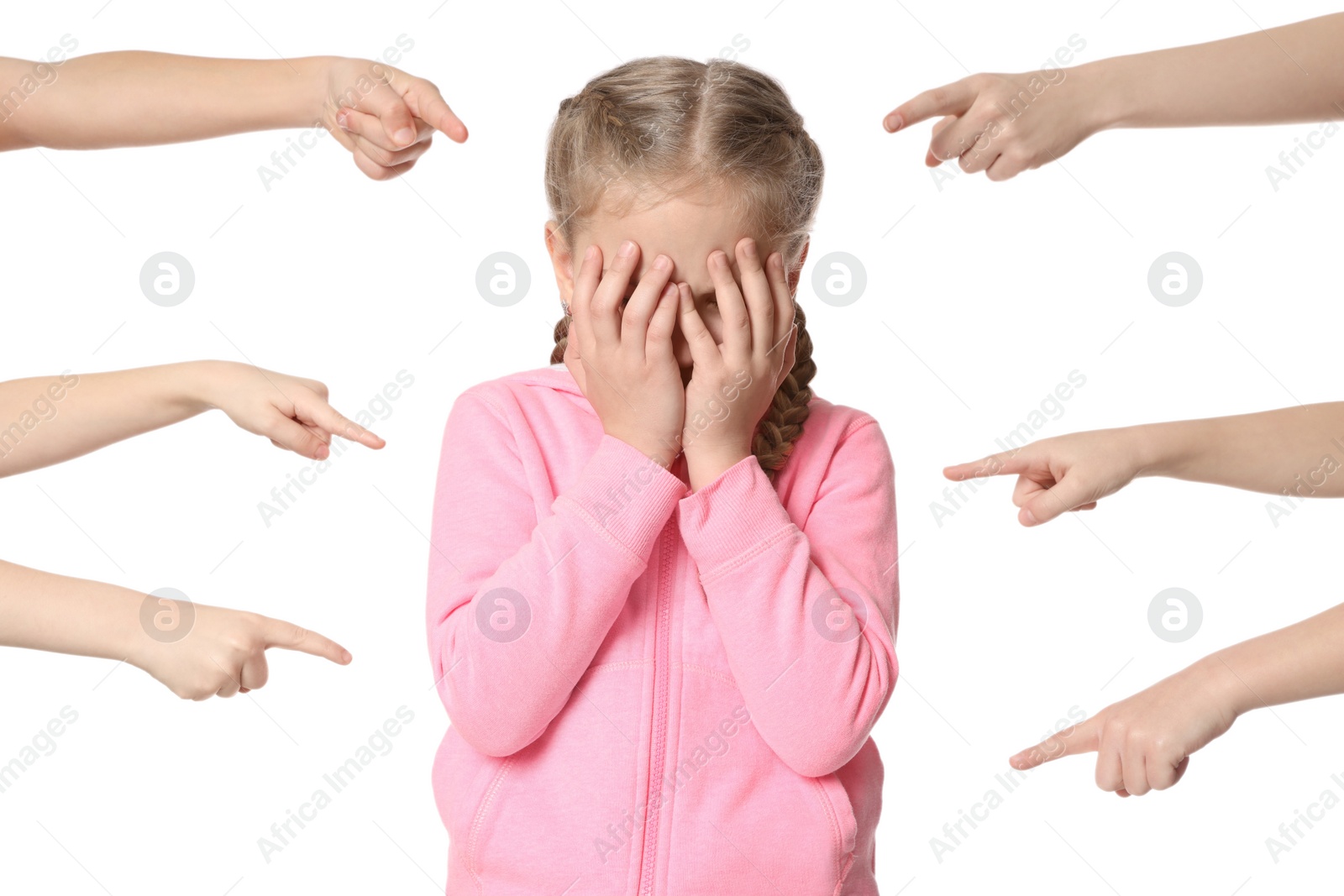 Photo of Kids pointing at upset girl on white background. Children's bullying