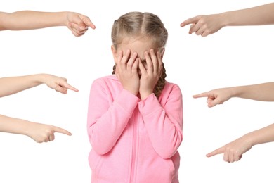 Kids pointing at upset girl on white background. Children's bullying