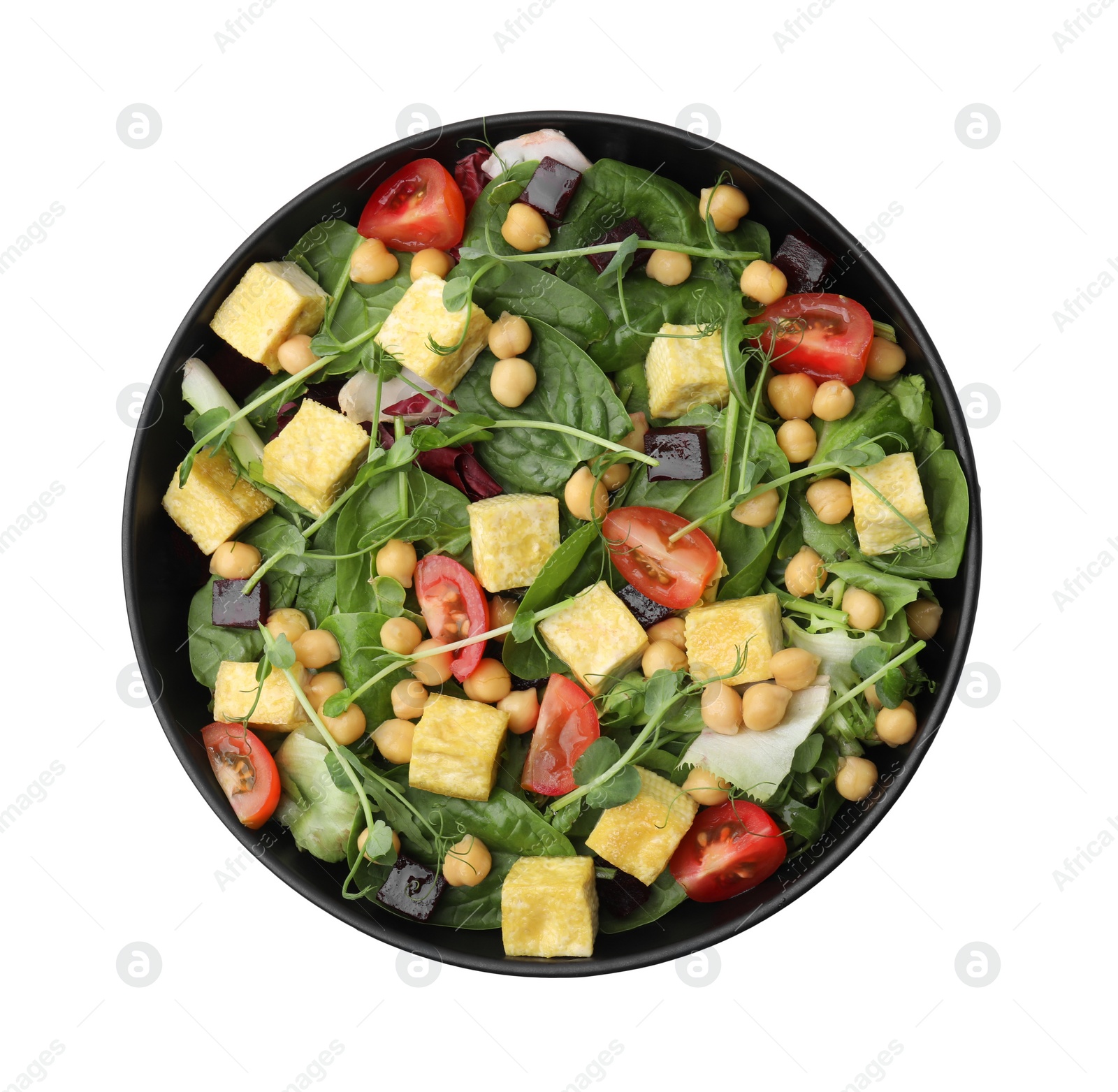 Photo of Bowl of tasty salad with tofu, chickpeas and vegetables isolated on white, top view