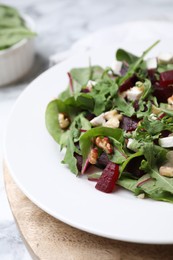 Delicious beet salad served on table, closeup