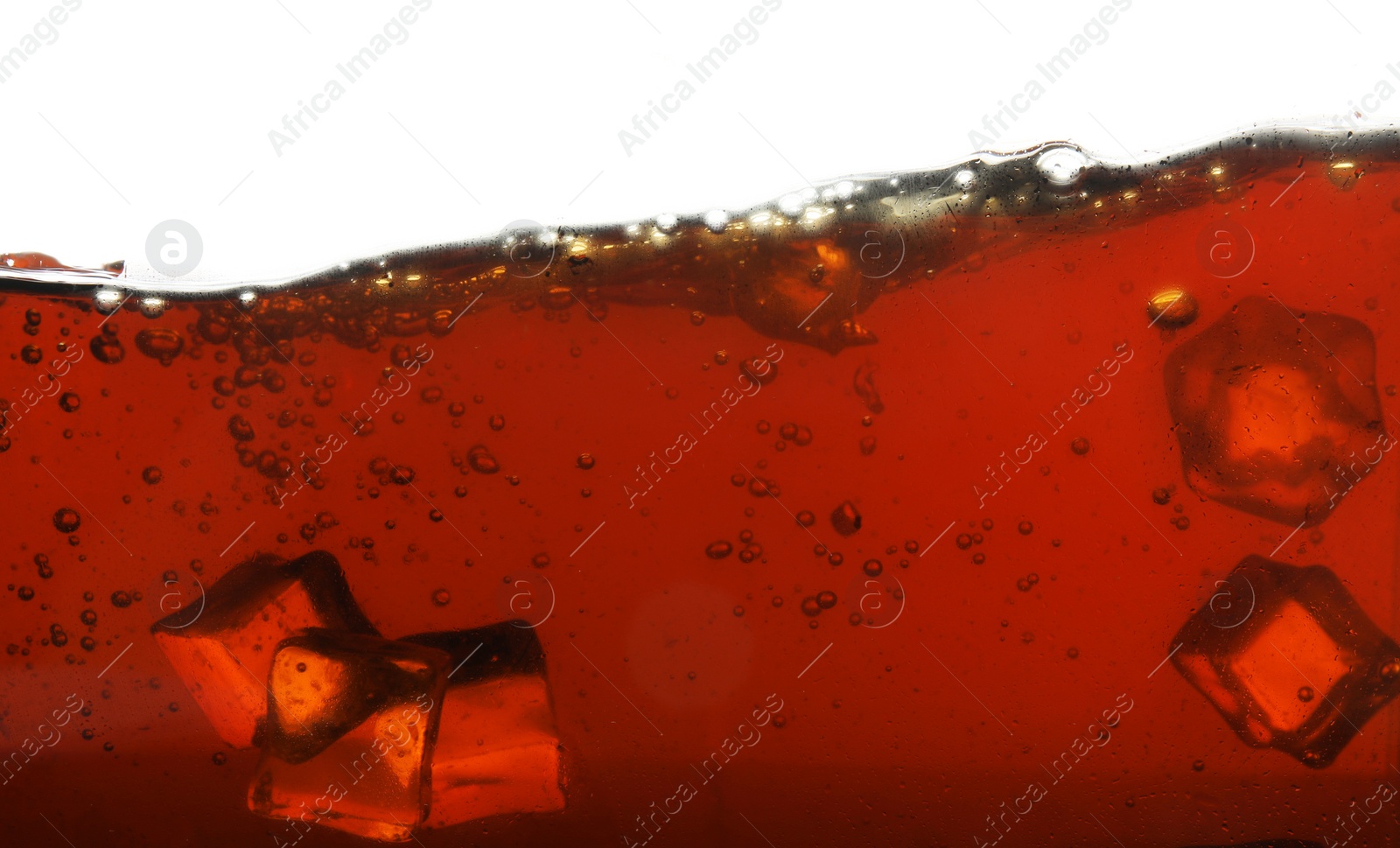 Photo of Closeup view of tasty refreshing cola with ice cubes on white background