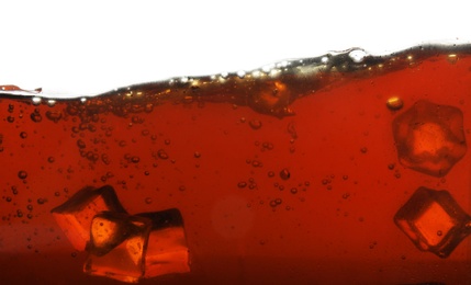 Photo of Closeup view of tasty refreshing cola with ice cubes on white background