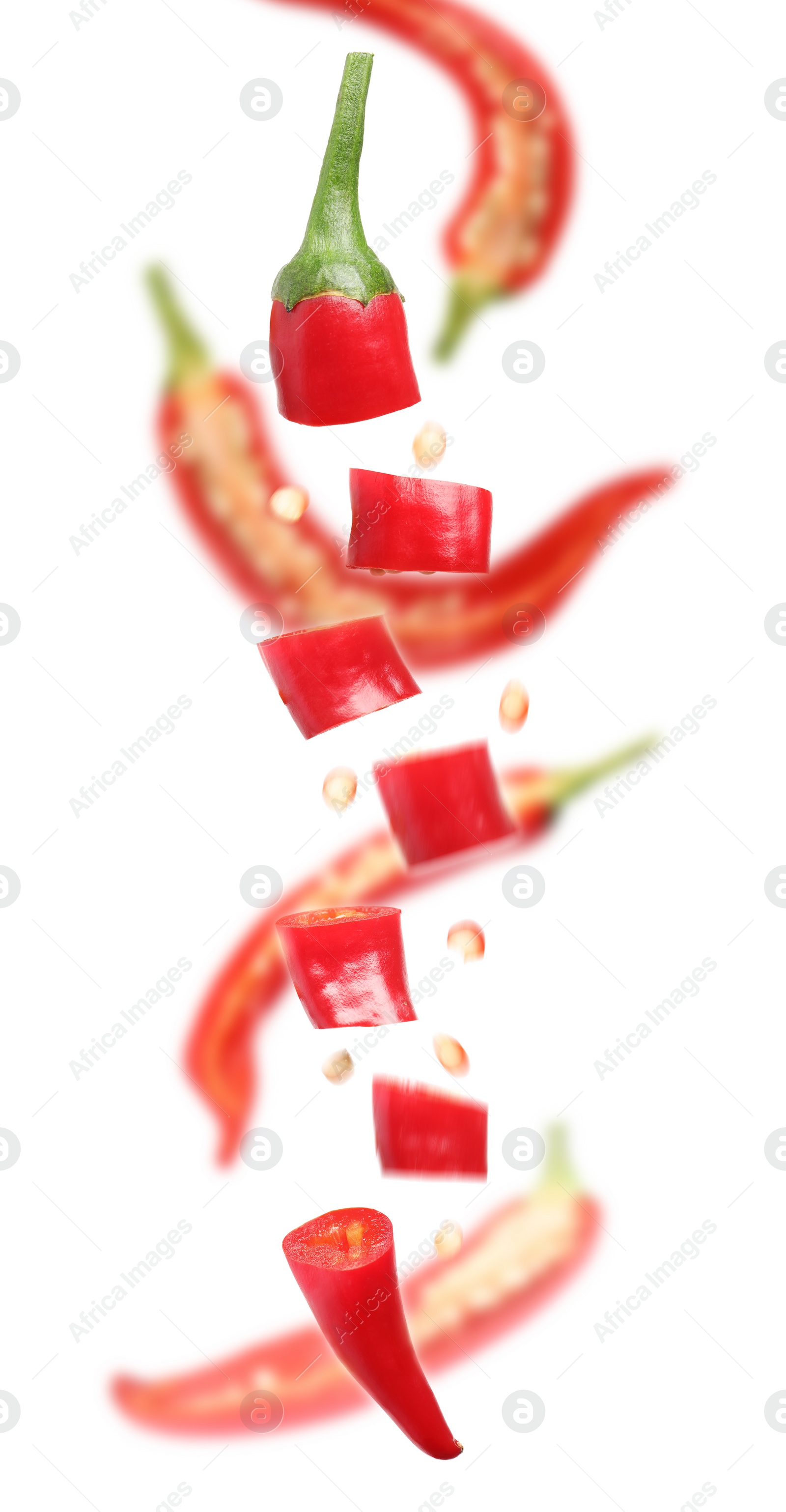 Image of Pieces of ripe red chili peppers falling on white background. Vertical banner design