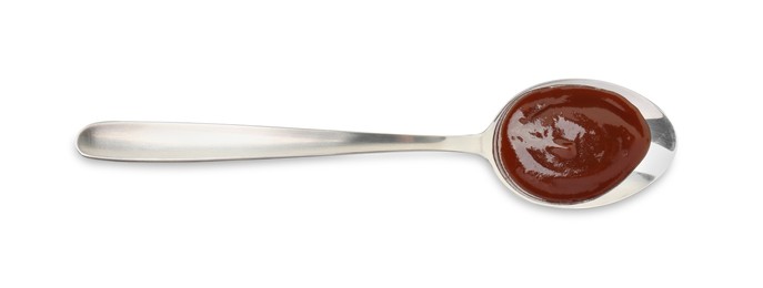 Tasty barbecue sauce in spoon isolated on white, top view