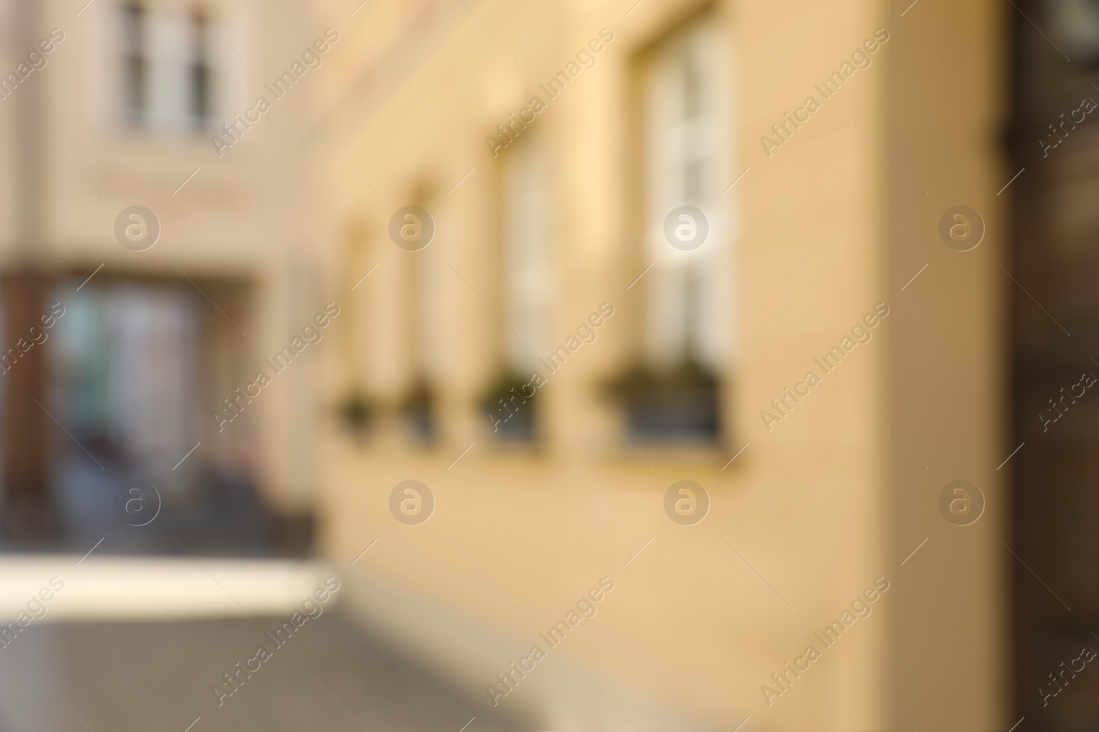 Photo of Blurred view of city street with beautiful building. Bokeh effect