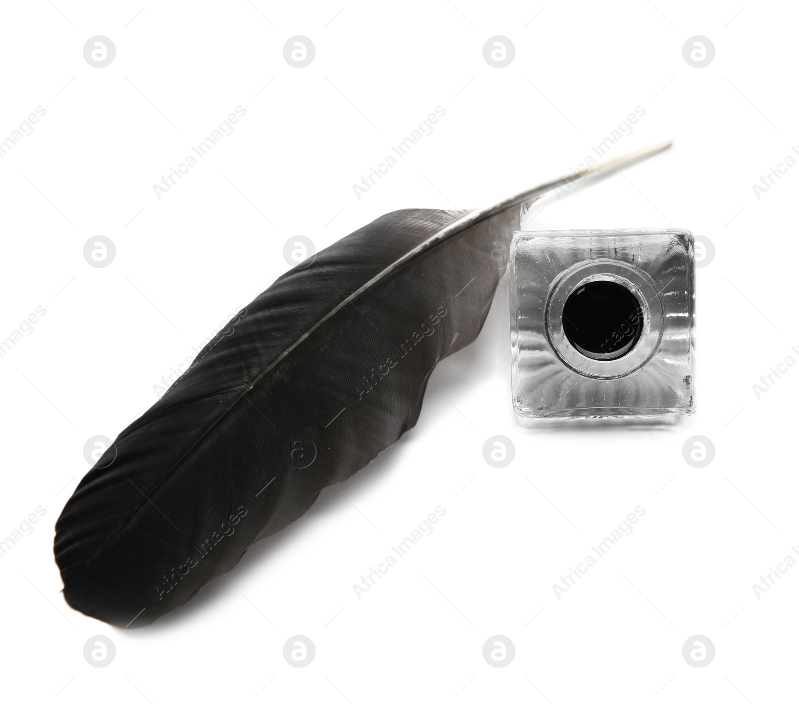 Photo of Feather pen and inkwell on white background, top view