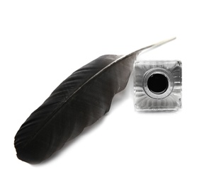 Photo of Feather pen and inkwell on white background, top view