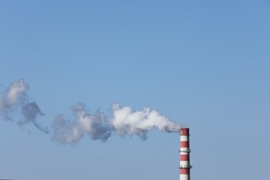 Polluting air with smoke from industrial chimney outdoors, space for text. CO2 emissions