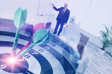 Image of People having business meeting and dart board with arrows. Double exposure