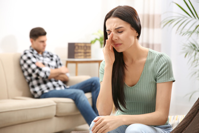 Woman crying after quarrel with her boyfriend at home. Relationship problems