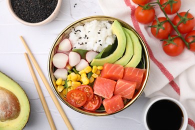 Delicious poke bowl with salmon, avocado and vegetables on white textured table, flat lay