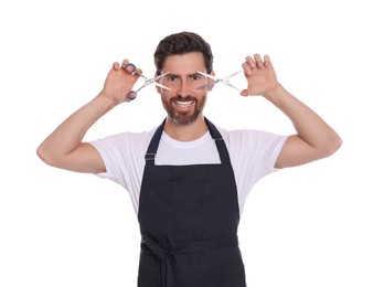 Photo of Smiling hairdresser with scissors on white background