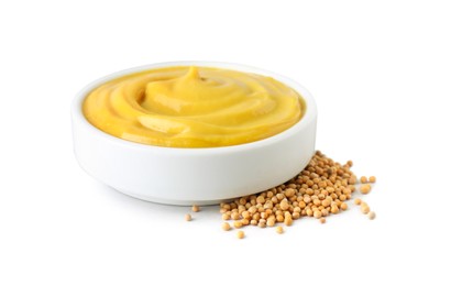 Photo of Bowl with delicious mustard and seeds on white background