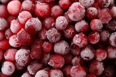 Photo of Frozen red cranberries as background, top view