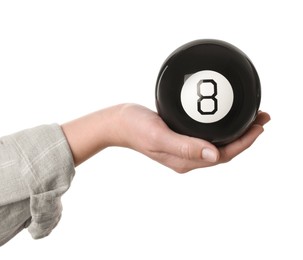 Photo of Woman holding magic eight ball on white background, closeup