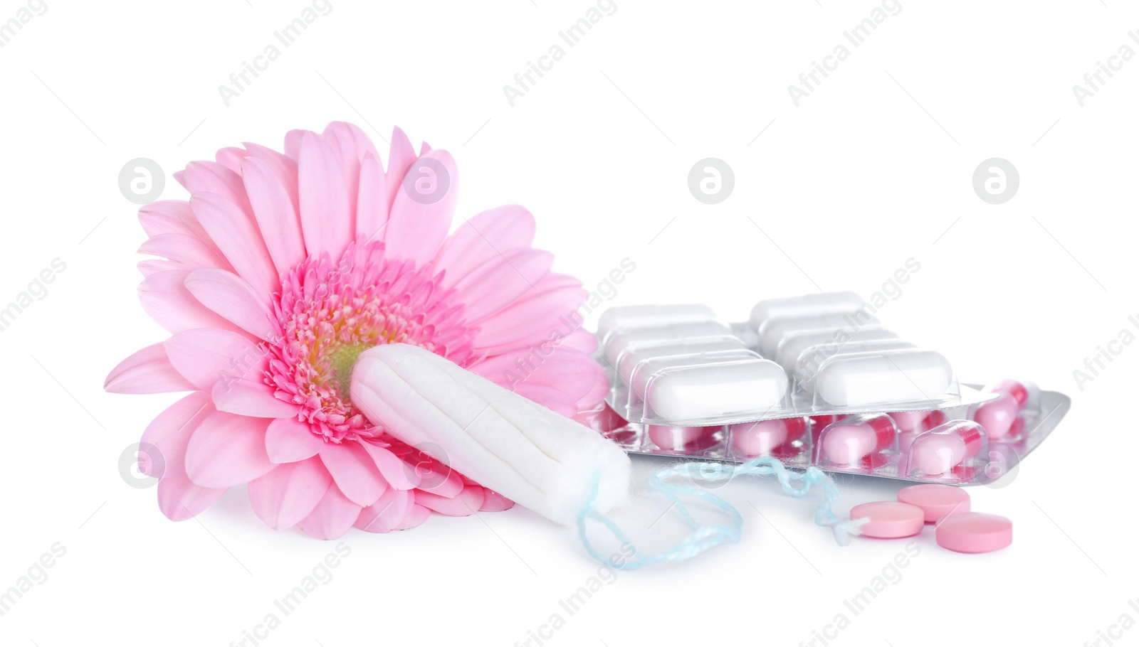 Photo of Hygienic tampons, pills and flower on white background. Gynecology concept