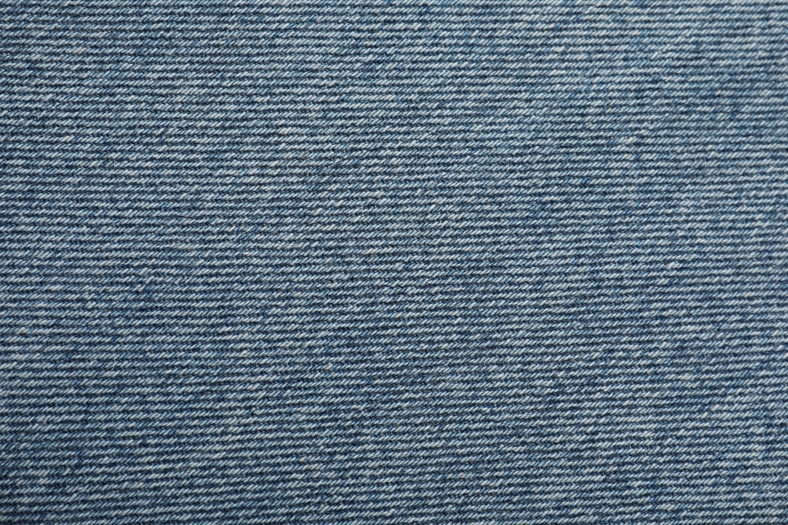 Photo of Texture of blue jeans as background, closeup