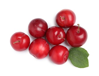 Photo of Delicious ripe cherry plums with leaves on white background, top view
