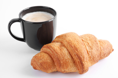 Photo of Tasty fresh croissant and coffee on white background