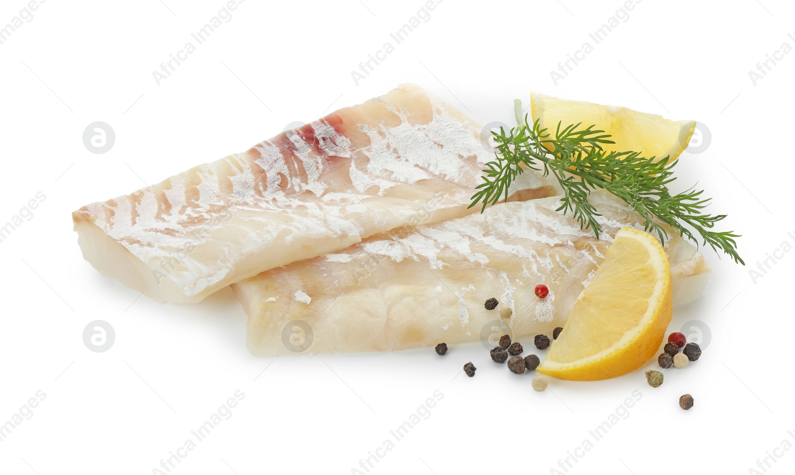 Photo of Fresh raw cod fillets with peppercorns, dill and lemon isolated on white