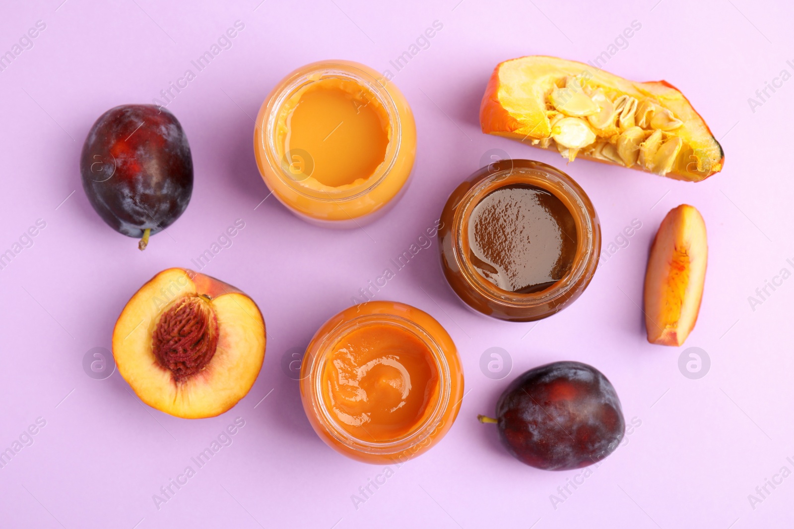 Photo of Flat lay composition with healthy baby food and ingredients on violet background