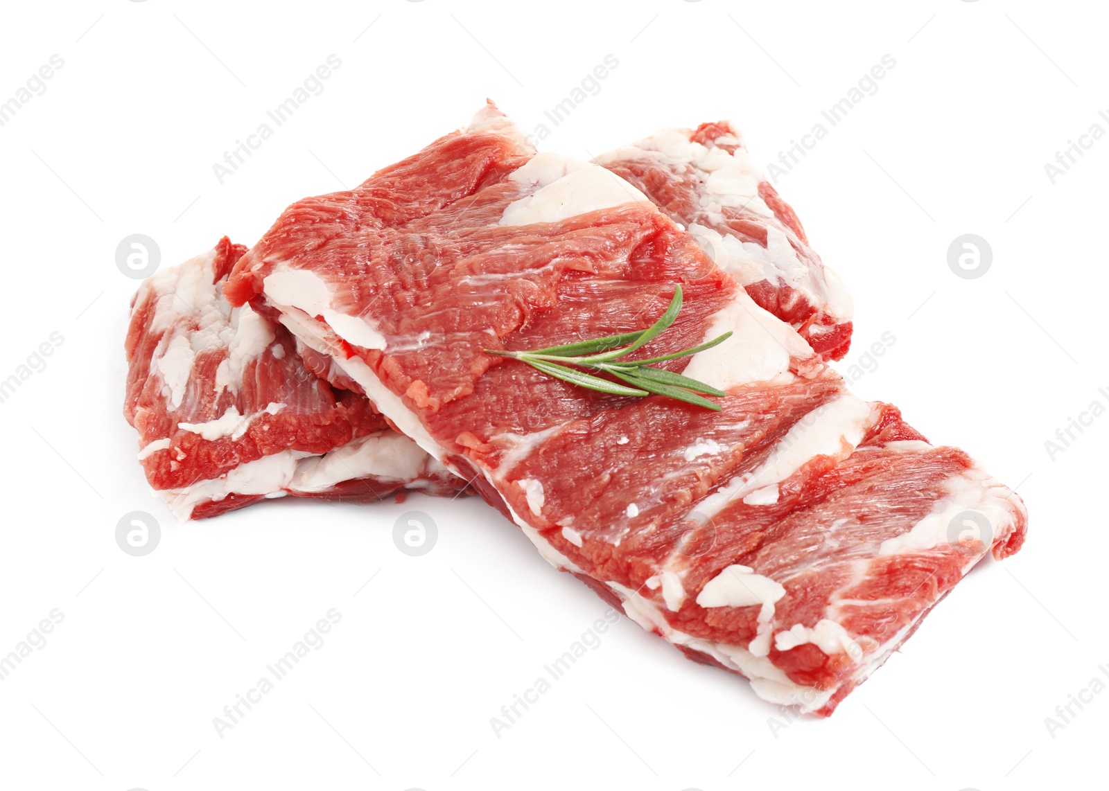 Photo of Raw ribs with rosemary on white background