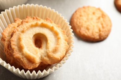 Photo of Danish butter cookies on grey table, closeup. Space for text