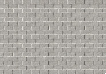 Grey tiled or brick surface as background, top view