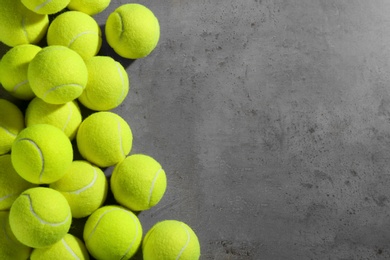 Photo of Tennis balls on grey table, flat lay. Space for text