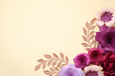 Different beautiful flowers and branches made of paper on beige background, flat lay. Space for text