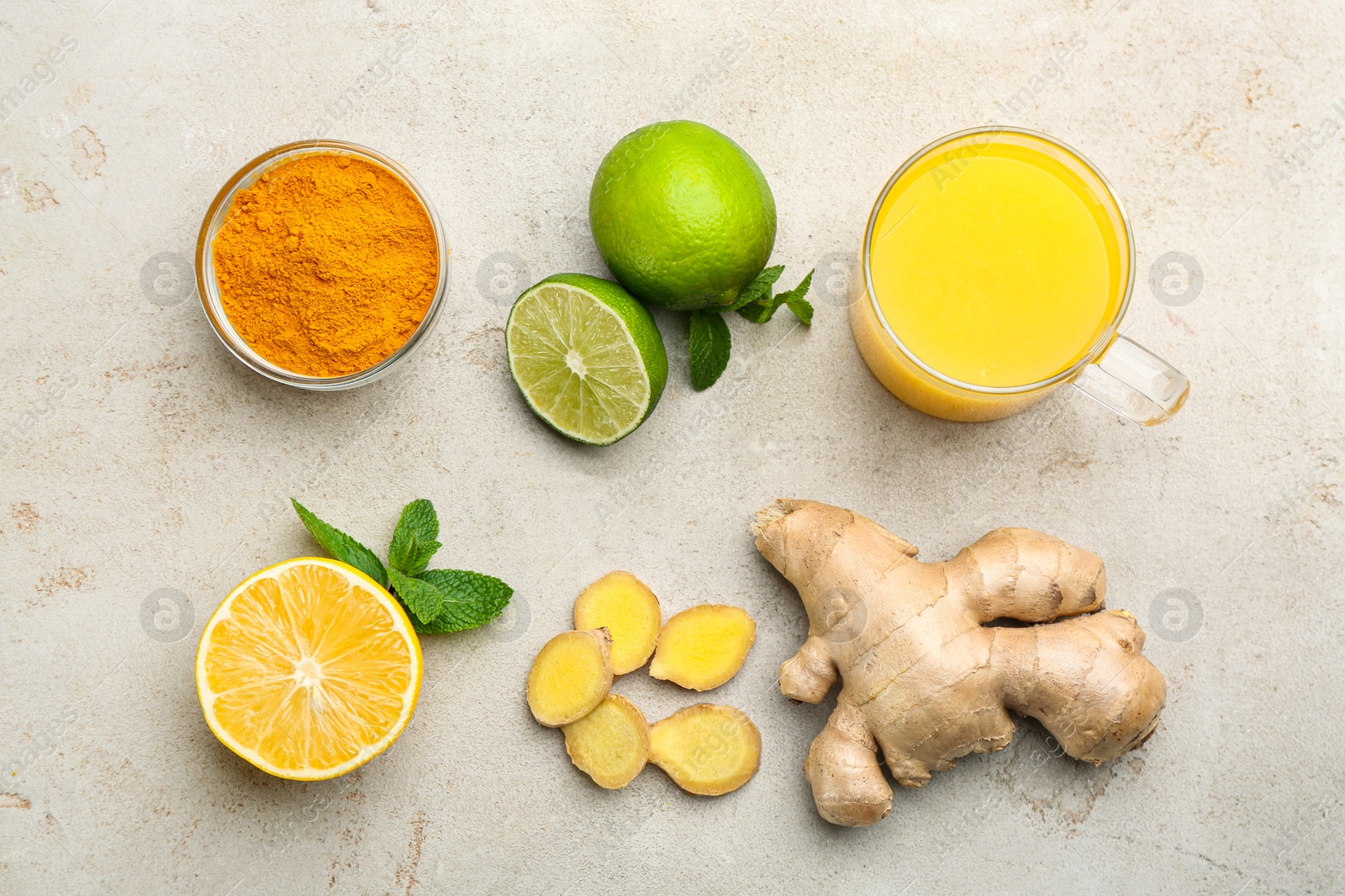 Photo of Flat lay composition with immunity boosting drink and ingredients on light table