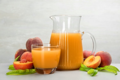 Natural freshly made peach juice on light table