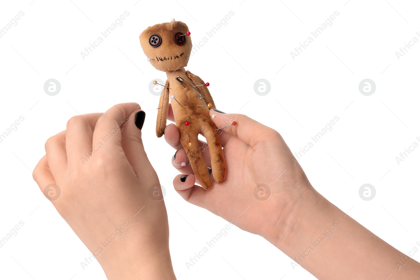 Photo of Woman stabbing voodoo doll with pin on white background, closeup